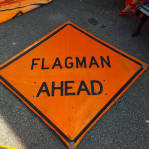 Flagman Ahead Sign