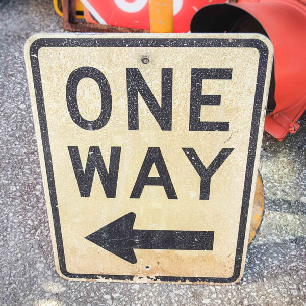 American One Way Left Road Sign
