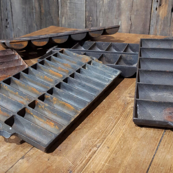 Collection Of Cast Iron Corn Tins