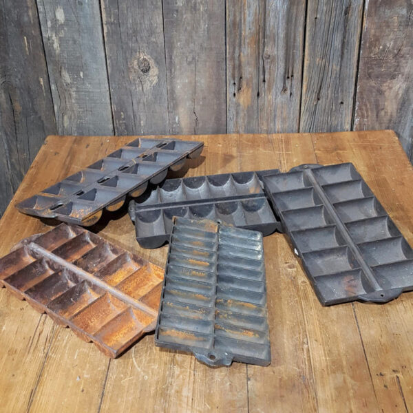 Collection Of Cast Iron Corn Tins
