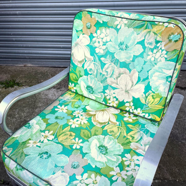 Metal Glider Chair with Floral Cushions