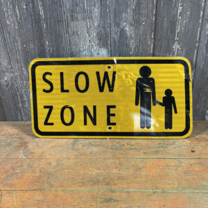 Yellow Slow Zone Street Sign