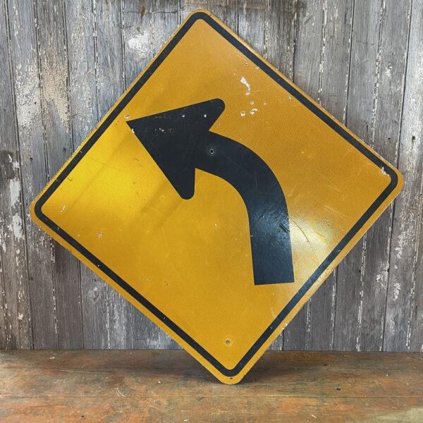 Turn Ahead Arrow Road Sign